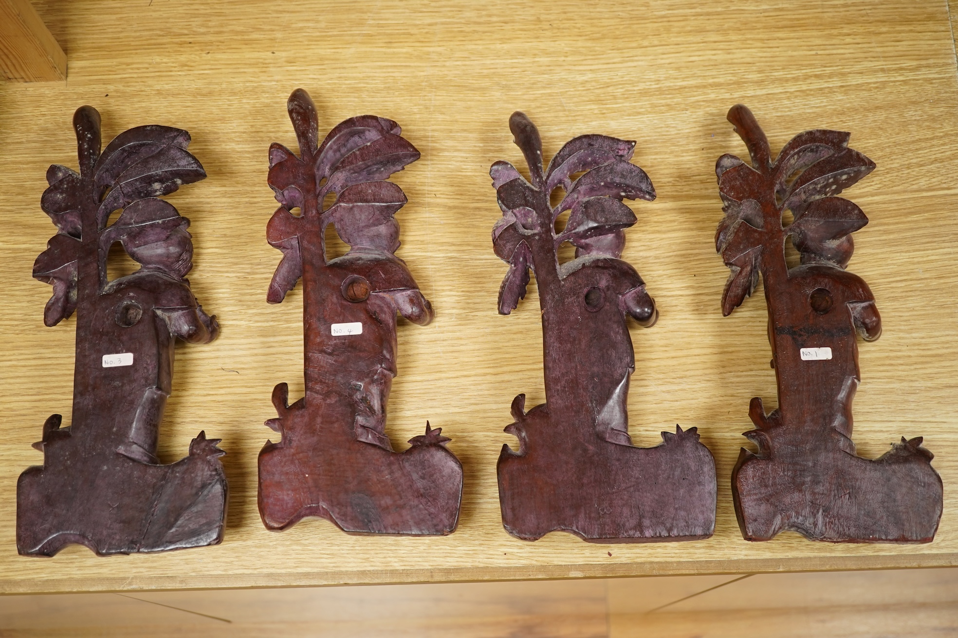 Four 1960's Chinese Cultural Revolution figures of boys holding a rifle, 33cm high